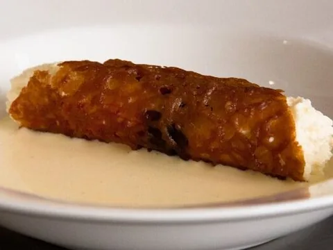 A crisp brandy snap shown with a ricotta filling