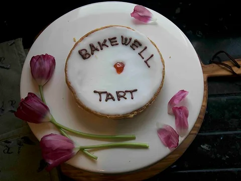 A fondant-iced cherry Bakewell tart