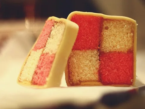 A slice of checkerboard Battenberg cake
