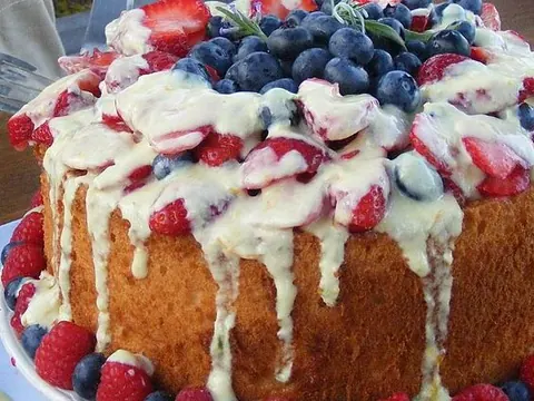 A prepared angel-food cake topped with berries