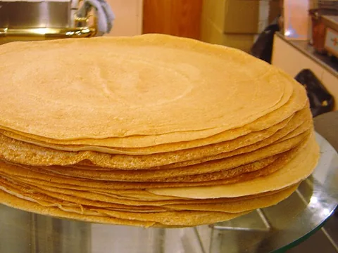 A neat stack of prepared crêpes