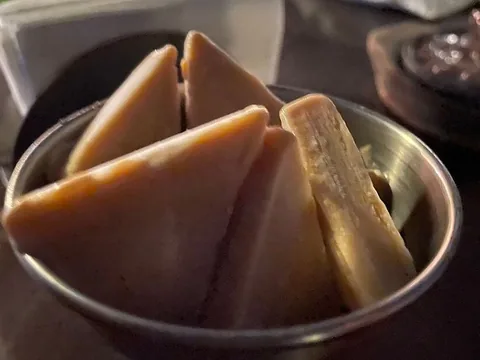 Prepared malai kulfi pieces in a bowl