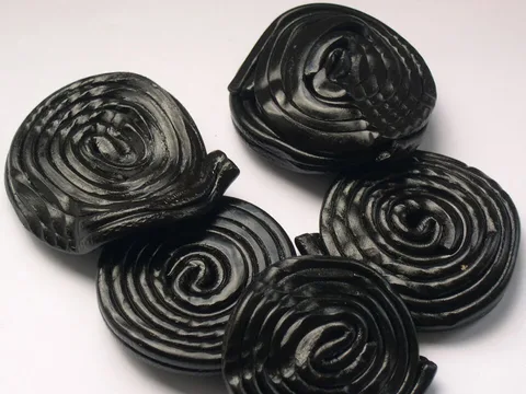 Coiled black sweet liquorice wheels