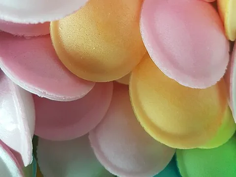 Pastel edible wafer flying-saucer candies