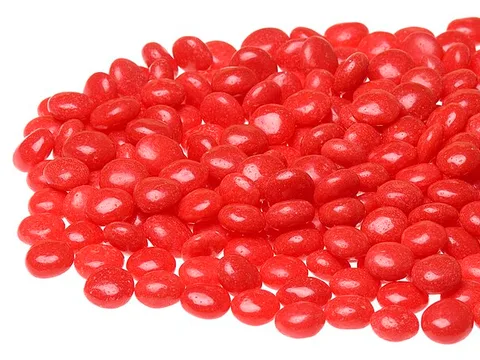 A pile of small red Red Hots cinnamon candies