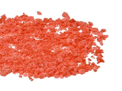 Loose strawberry-flavored Pop Rocks popping sugar granules
