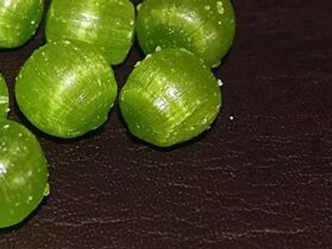 Unwrapped green Scottish sour-plum hard candies