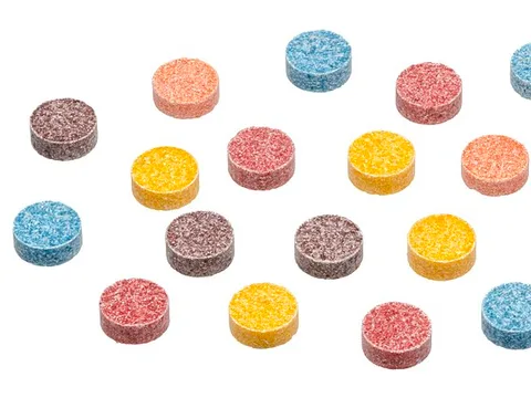 Colored Razzles candy tablets with flower-like tops