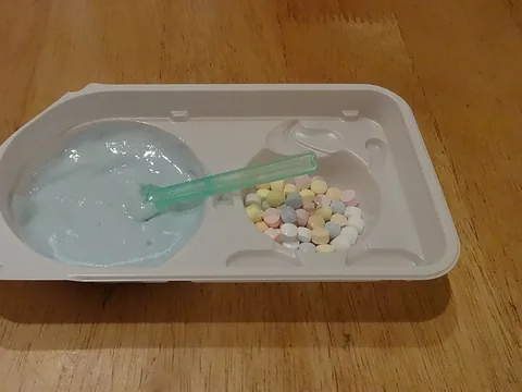 Prepared Kracie Nerunerunerune aerated dipping candy in its mixing tray