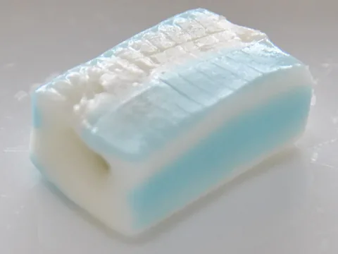 An unwrapped UHA Puccho soda-flavored soft candy with gummy bits