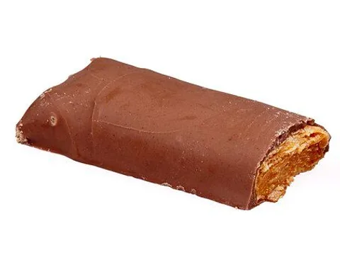A split Butterfinger bar showing its flaky peanut-butter center