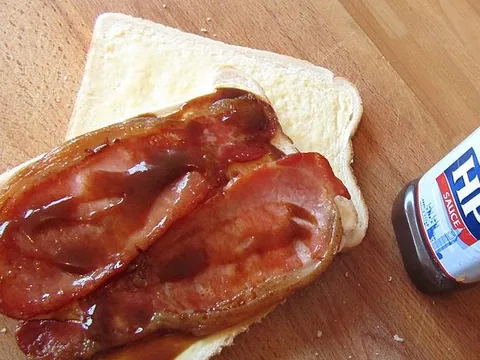 HP brown sauce served on a bacon sandwich