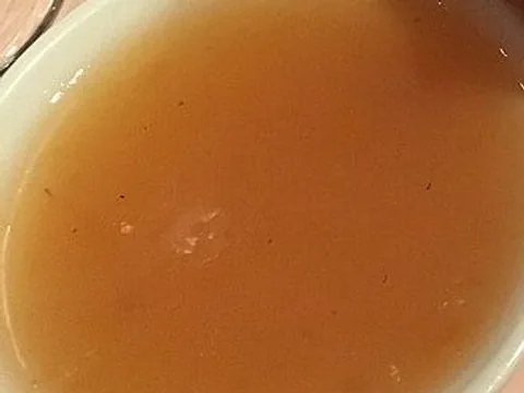 Orange duck sauce in a white dish