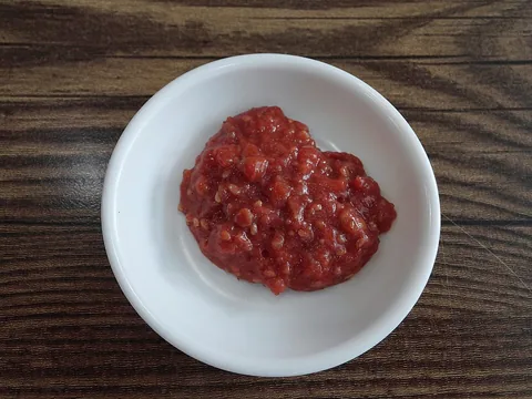 Seasoned ssamjang paste in a white bowl