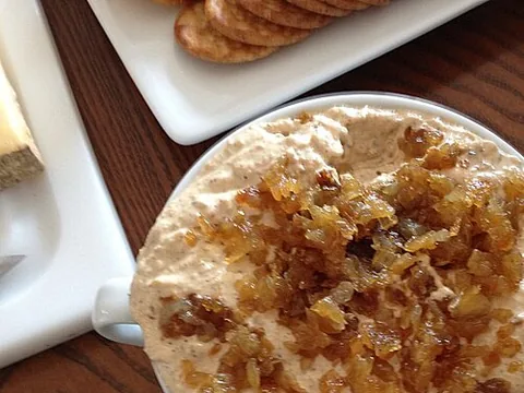 Prepared French onion dip topped with caramelized onions