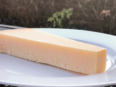 A wedge of Parmesan cheese