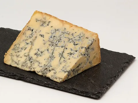 Blue Stilton cheese with blue mould veins