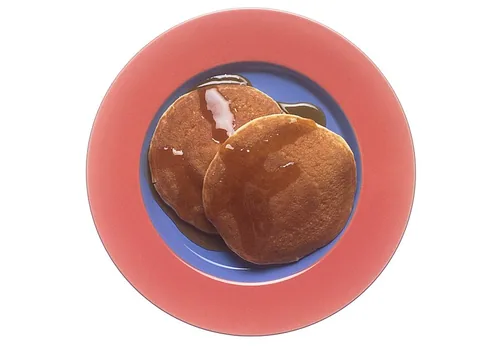 Maple syrup served on pancakes