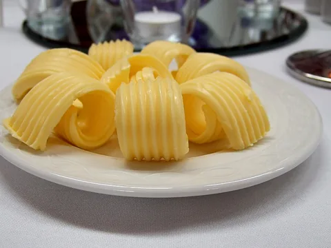 Dairy butter curled on a plate