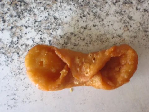 Traditional folded pestiño pastry