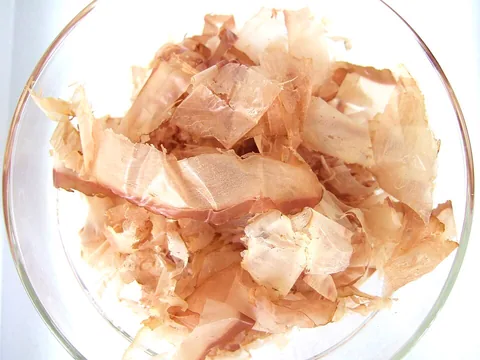 Thin dried katsuobushi bonito flakes in a clear dish