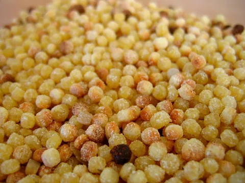 Dry toasted golden fregula pasta pearls