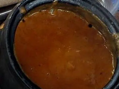 Prepared Ethiopian shiro stew in a black bowl
