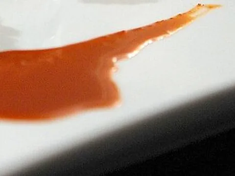 Prepared awaze sauce on a white plate