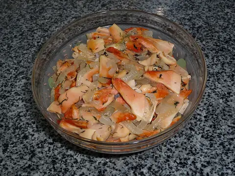 Cooked chicken-of-the-woods mushroom pieces in a glass dish