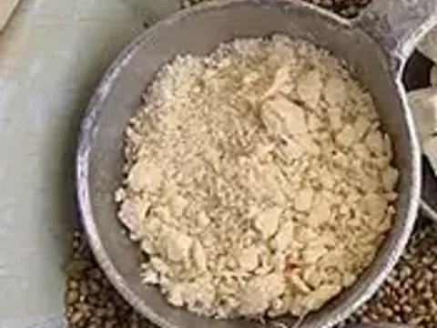 Naturally dry baobab fruit-pulp powder on a spoon