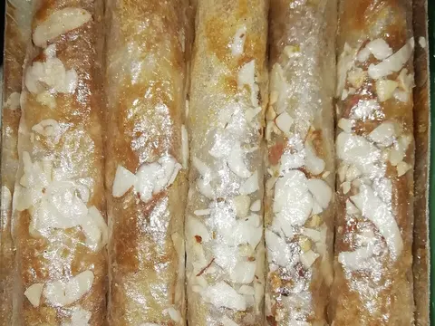 Folded pootharekulu paper-thin sweet rolls