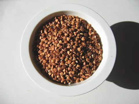 Roasted buckwheat kasha groats in a white bowl