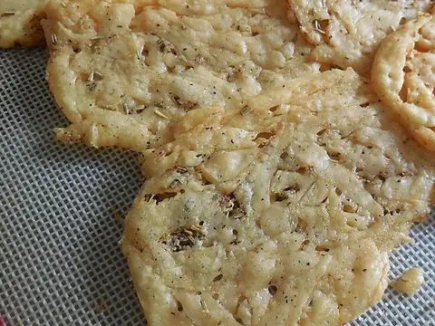 Crisp golden baked-cheese pieces with a lacy texture