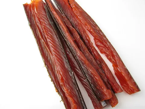 Red-brown dried salmon jerky strips