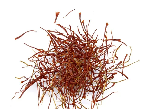 Generic saffron threads on a white background